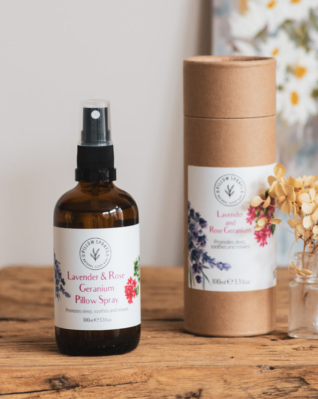A Lavender and Rose Geranium Pillow Spray on a bedside table