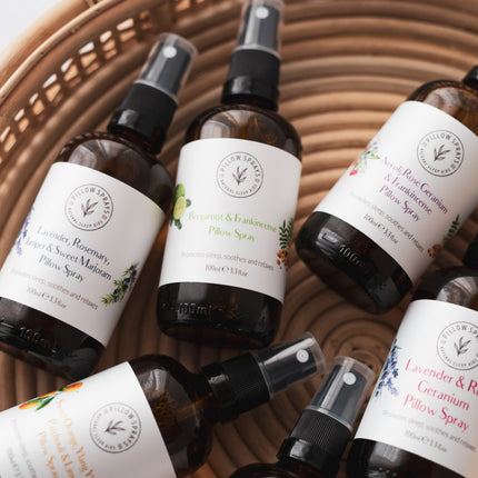 6 pillow sprays in glass bottles in a basket