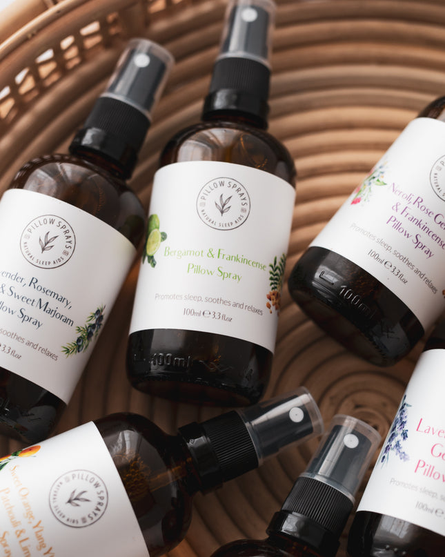 6 pillow sprays in glass bottles in a basket