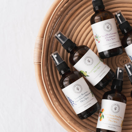 A set of 6 Pillow sprays in a basket