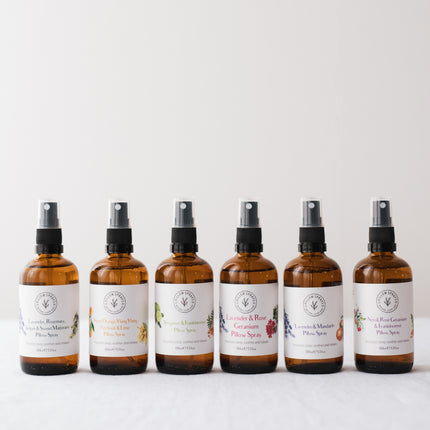 A set of 6 pillow sprays arranged in a line all different scents