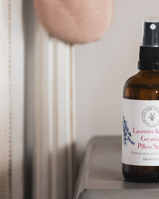 Pillow spray bottle on a surface with a neutral background