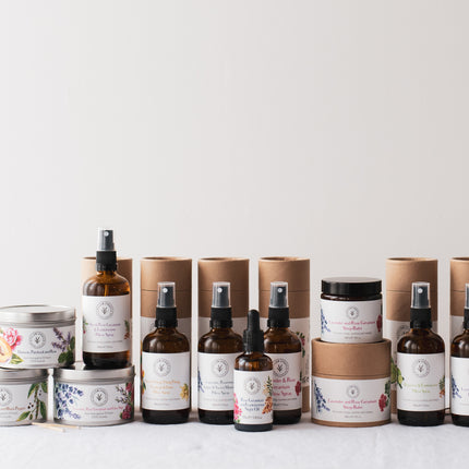 A range of natural sleep aids including pillow sprays, a night oil, a sleep balm, and candles
